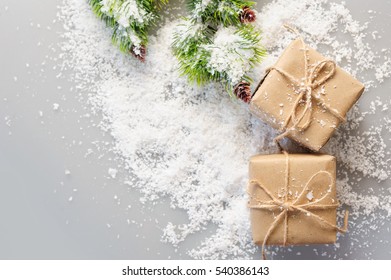 Gift Boxes And Fir Branches On Artificial Snow