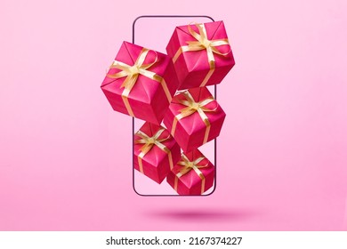 Gift boxes flying from smartphone on pink background. Online win, gift, lottery or shopping concept. - Shutterstock ID 2167374227