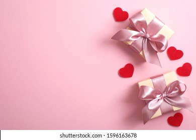 Gift boxes and hears on pink background. Happy Mother's, Valentine's Day or birthday greeting card design.