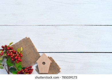 Gift boxes with hearts handmade and red berries on a light wooden background. Celebratory background. Christmas. New Year. Gifts in a rustic style. - Powered by Shutterstock