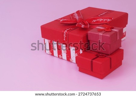 Gift boxes on pink background. Birthday and resent concept. Copy space for text.
