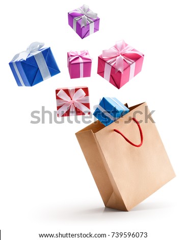 Gift boxes pop out from paper bag isolated on white background