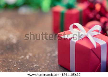 Gift boxes with a white bow against a background bokeh of twinkling  Luxury New Year gift. Christmas gift. Christmas background with gift box Christmastime celebration