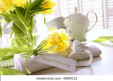 Gift Card For Mother's Day On Table With Flowers