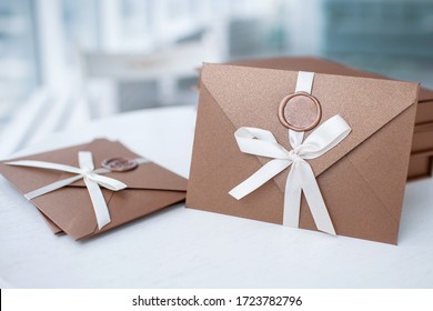 Gift Certificate, Gift Voucher Or Discount. Close-up Photo Of Bronze Invitation Envelope With A Wax Seal, A Gift Certificate, A Card, A Wedding Invitation Card