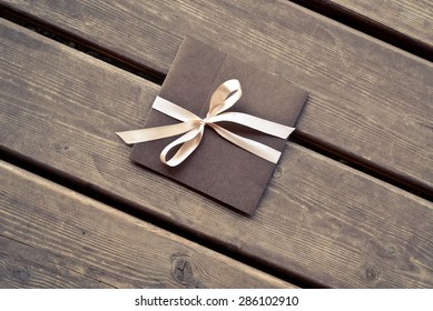 Gift Envelope On The Wooden Floor