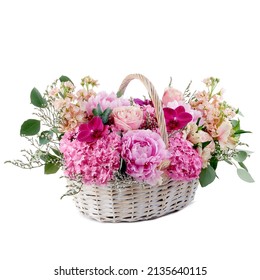 Gift flower white basket with various pink flowers isolated on white background