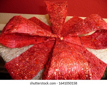 The Gift Has A Large Red Bow