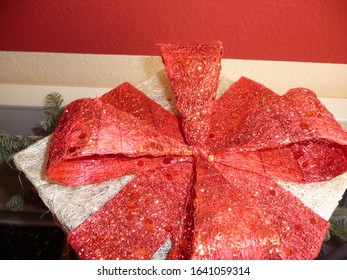 The Gift Has A Large Red Bow