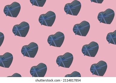 Gift For Him. Pattern Of Blue Heart-shaped Boxes On A Pink Background As An Illustration And Symbol Of Valentine's Day. 