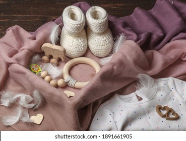 Gift Hygge Box For A Newborn With Rattles And Toys Made Of Natural Wood, Knitted Boots. Eco-friendly Gift Set For The Future Baby