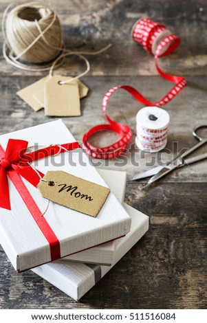 Similar – Foto Bild Weiße Geschenkbox mit Aufkleber auf Holztisch.