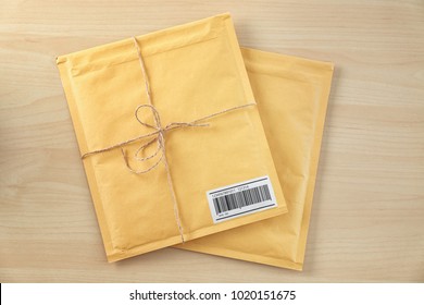 Gift Padded Envelopes On Wooden Table