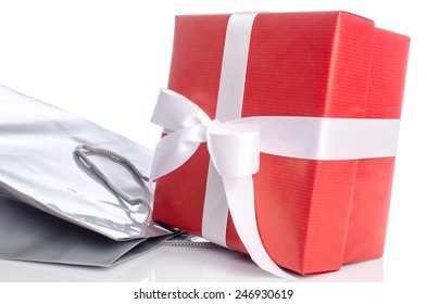 Gift with paper shopping bag, isolated on white
