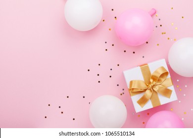 Gift Or Present Box, Balloons And Confetti On Pink Table Top View. Flat Lay Composition For Birthday, Mother Day Or Wedding.