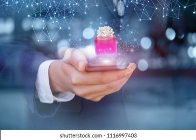 Gift receive from mobile phone. Concept of bonuses in the network. - Shutterstock ID 1116997403
