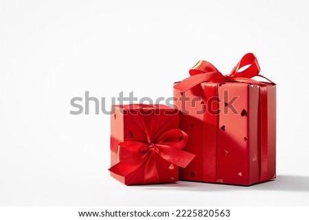Gift in a red package on a white background. Happy Holidays.