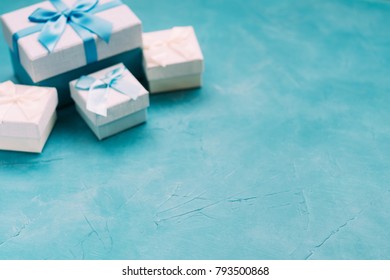 Gift selection on blue background. Copyspace concept. Holiday atmosphere. Present giving. Warm memories