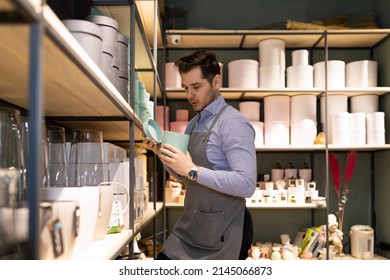 Gift Shop Worker And Gift Wrapping Tidy Up The Shelves In The Store, Inventory Concept