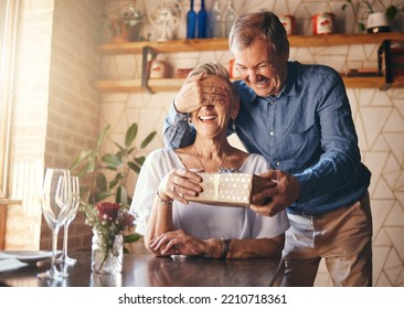 Gift, surprise and senior couple in restaurant for retirement celebration or happy birthday with wine glass, present and roses. Elderly woman with marriage anniversary event with vintage fine dining - Powered by Shutterstock