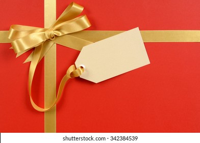 Gift Tag, Red Christmas Gift Background, Gold Ribbon Bow, Copy Space