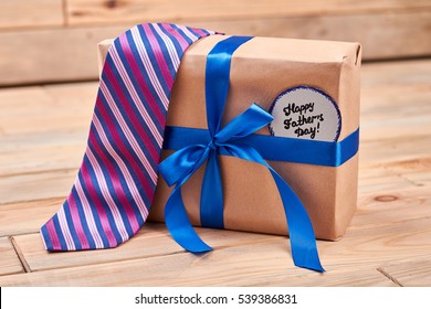 Gift, tie and Father's card. Striped tie on present box. Best quality gifts for dads. - Powered by Shutterstock