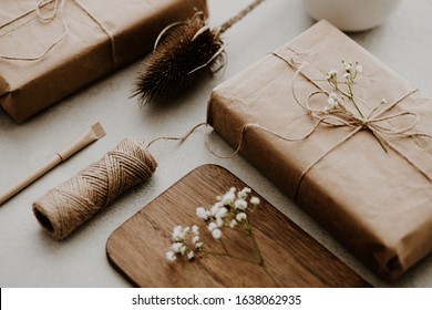 Gift Wrapped In Paper With Dried Flowers And String
