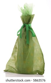 A Gift Wrapped Wine Bottle Over A White Background