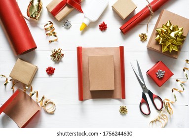 Gift Wrapping Accessories. Beautiful Ribbons And Boxes With Gifts On A White Wooden Background.