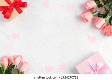 Giftbox And Pink Rose Flower On Marble White Table Background For Mother's Day Holiday Greeting Design Concept.