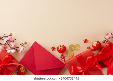 Gifting options for Chinese New Year. Top view shot of elegant gift boxes, red envelope, decor elements on beige background with promo placement