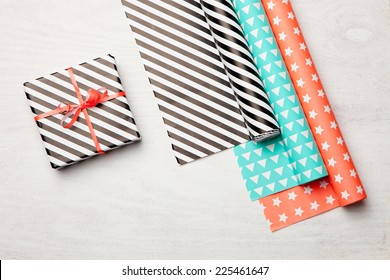 Gifts on white wooden background. Christmas background.