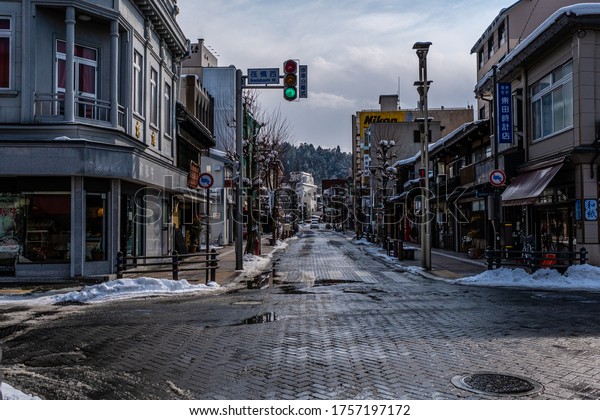 Gifu, Japan - Feb 8, 2018 : In winter, Atmosphere\
in Takayama city. the crossroads in the city are snowy and wet\
slippery roads