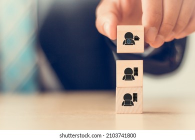 Gig economy, freelance, hybrid workplace concept. The combination of employment trend; growing to external hiring. Businessman puts wooden cubes with gig economy icon on smart background, copy space. - Shutterstock ID 2103741800