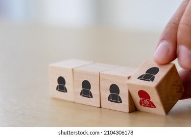 Gig economy, freelance, hybrid workplace concept. The combination of employment trend; growing to external hiring. Hand flips wooden cubes with gig economy icon on white background, copy space.