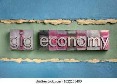Gig Economy Word Abstract In Gritty Letterpress Metal Type Against Handmade Paper, Business And Finance Concept