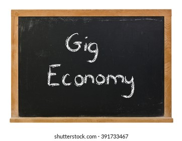  Gig Economy Written In White Chalk On A Black Chalkboard Isolated On White