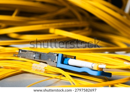 Gigabit interface transceiver module connected to a fiber optic patch cord, telecommunications network components