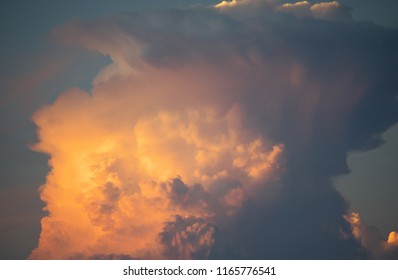 Gigantic Cumulonimbus Incus Or Anvil Illuminated By The Setting Sun
