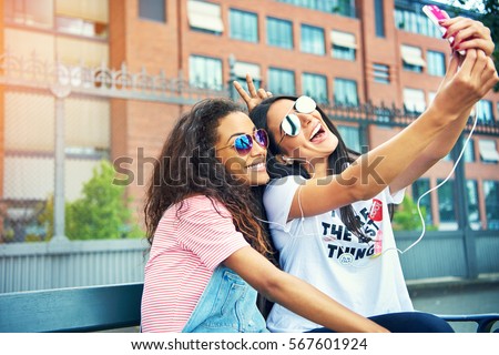 Similar – Image, Stock Photo Two happy and urban lesbian girlfriends