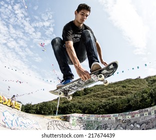 GIJON, SPAIN  Sep 2014:  Teenage skateboarders training in a skatepark of Gijon. Spain. September 11, 2014