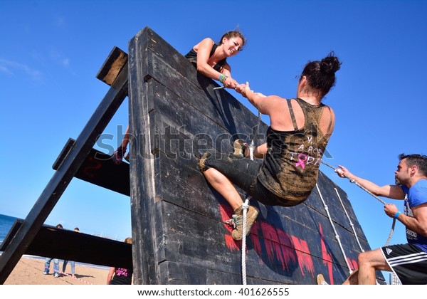 GIJON, SPAIN -\
SEPTEMBER 19: Storm Race, an extreme obstacle course in September\
19, 2015 in Gijon, Spain. Participants in extreme obstacle course\
jumping a wooden wall.\
