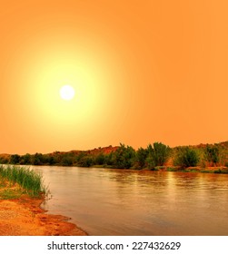 Gila River In Arizona With Yellow Sunset