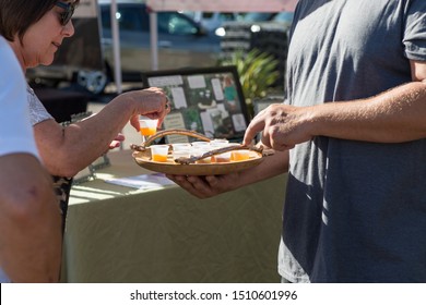 Gilbert, Arizona/USA - September 21, 2019: Vendors At Local Farmers Market Sampling And Tasting Vinegar And Sauce