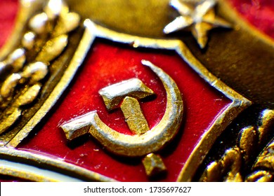 Gilded Symbol Of Communism On A Red Background.