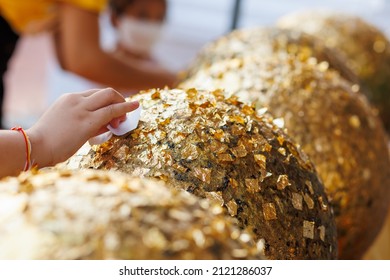 Gilding Gold Sheet On Steel Ball And Buddha Statue. Religious Ceremony Of Thailand