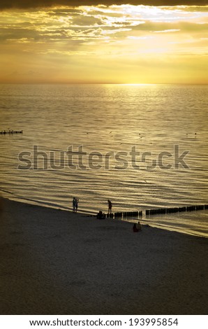 Similar – zwei personen bei sonnenuntergang im watt.