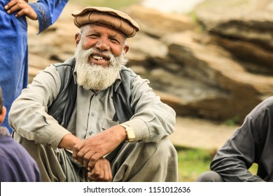 Gilgit, Pakistan - June 10, 2018: Old Smiling Pakistanian Man in Traditional Pakol 