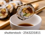 Gimbap or kimbap, Korean food made from cooked rice with vegetables, meat, egg and wrapped with dried seaweed dipping with sauce