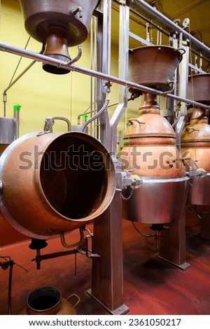 Gin alcoholic drink distillation process in copper tanks in Spanish bodega